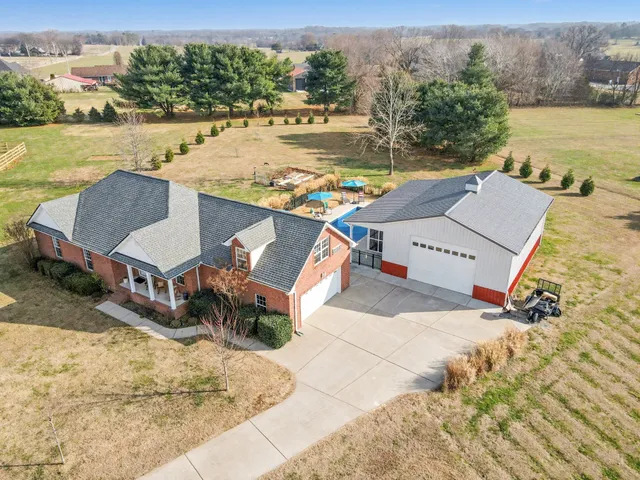 an aerial view of a house with lake view