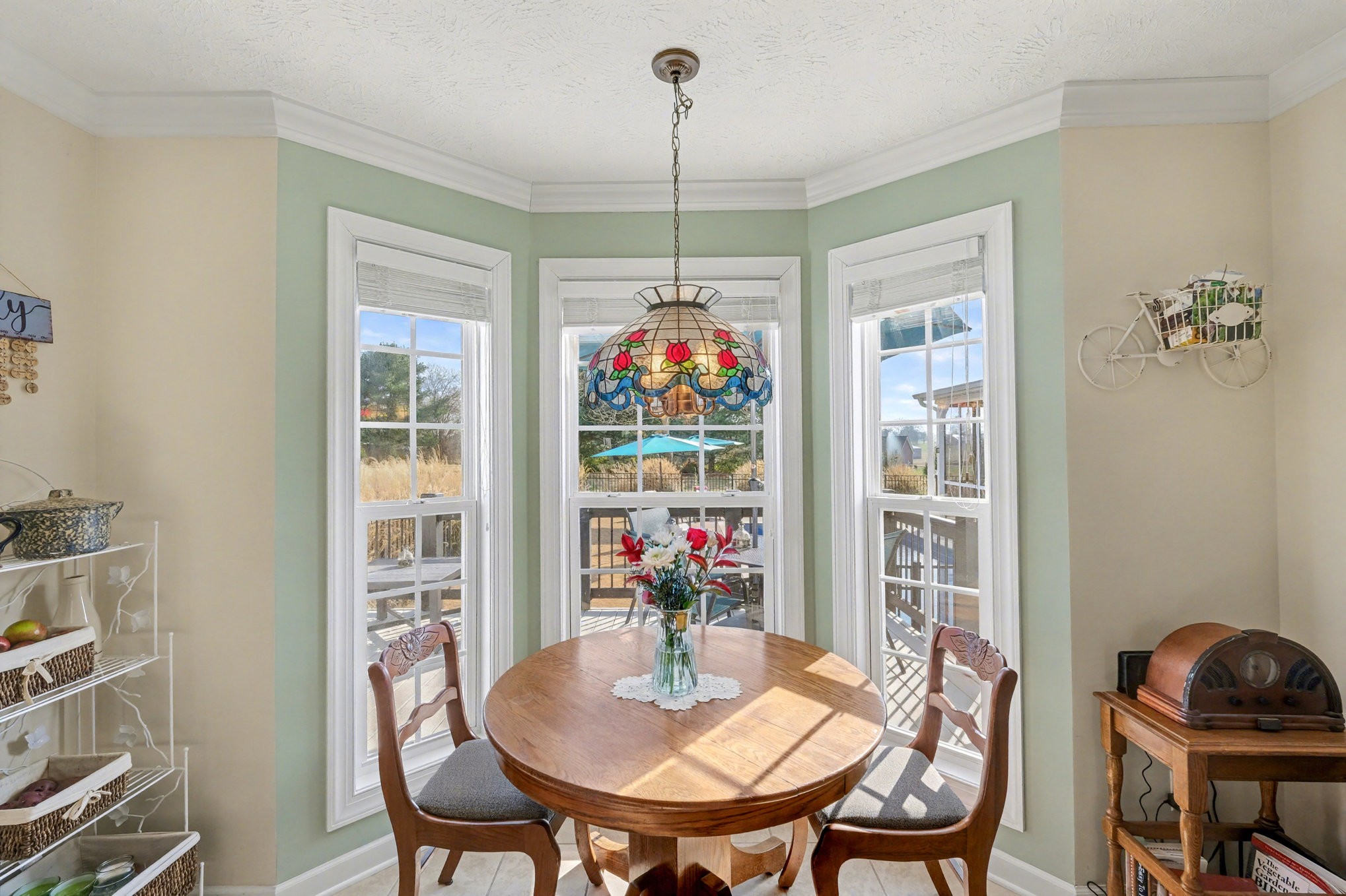 1002 Roland Court Cottontown, TN 37048 - Photo 20 of 41 a view of a dining room with furniture wooden floor and a chandelier