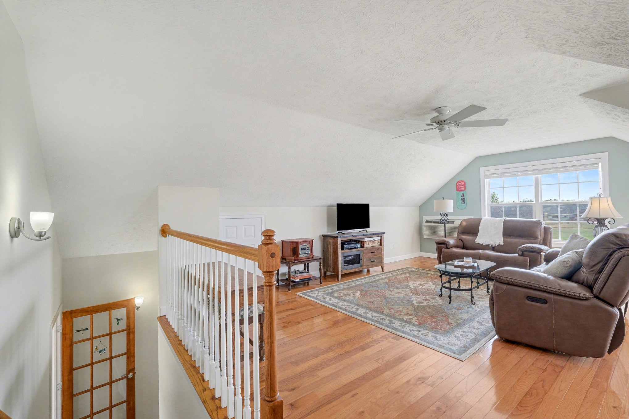 1002 Roland Court Cottontown, TN 37048 - Photo 29 of 41 a living room with furniture and a flat screen tv