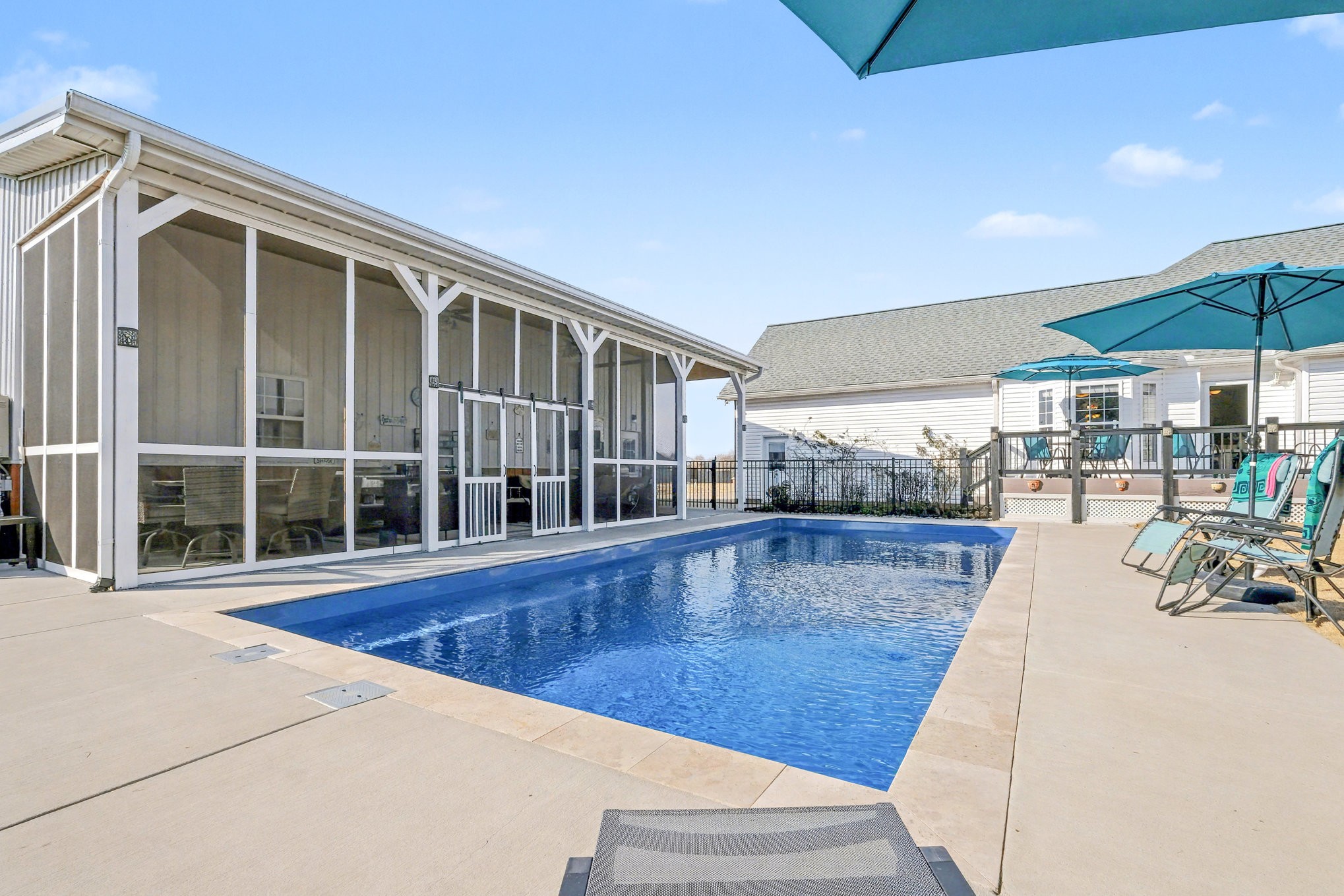 1002 Roland Court Cottontown, TN 37048 - Photo 6 of 41 a view of a patio with a table and chairs under an umbrella