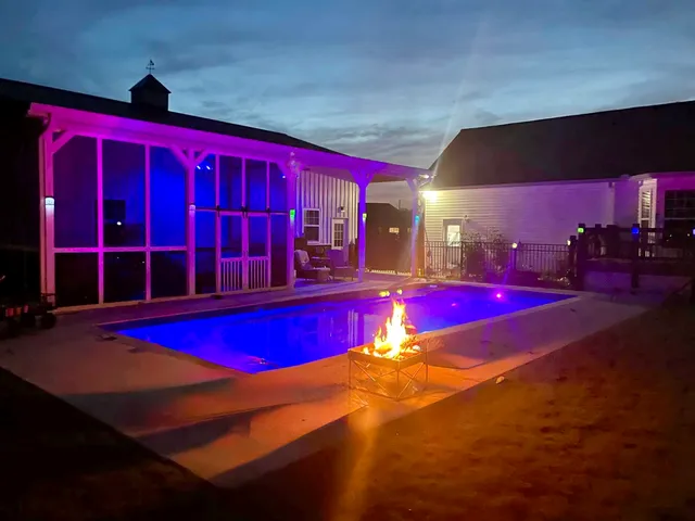 a view of a pool with a yard