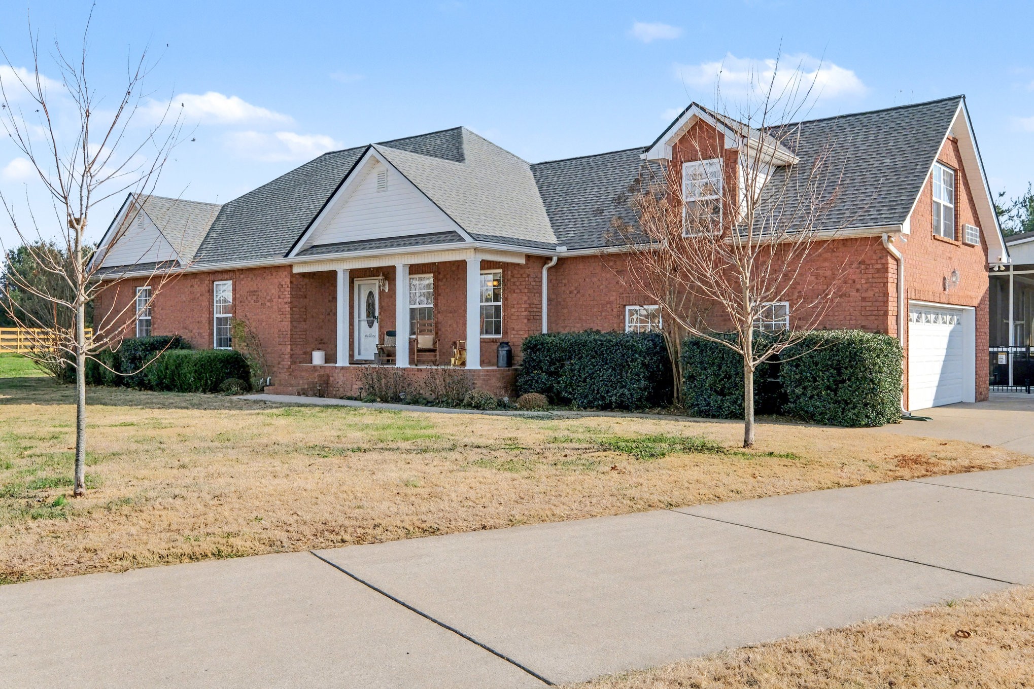 1002 Roland Court Cottontown, TN 37048 - Photo 9 of 41 a front view of a house with a yard and garage