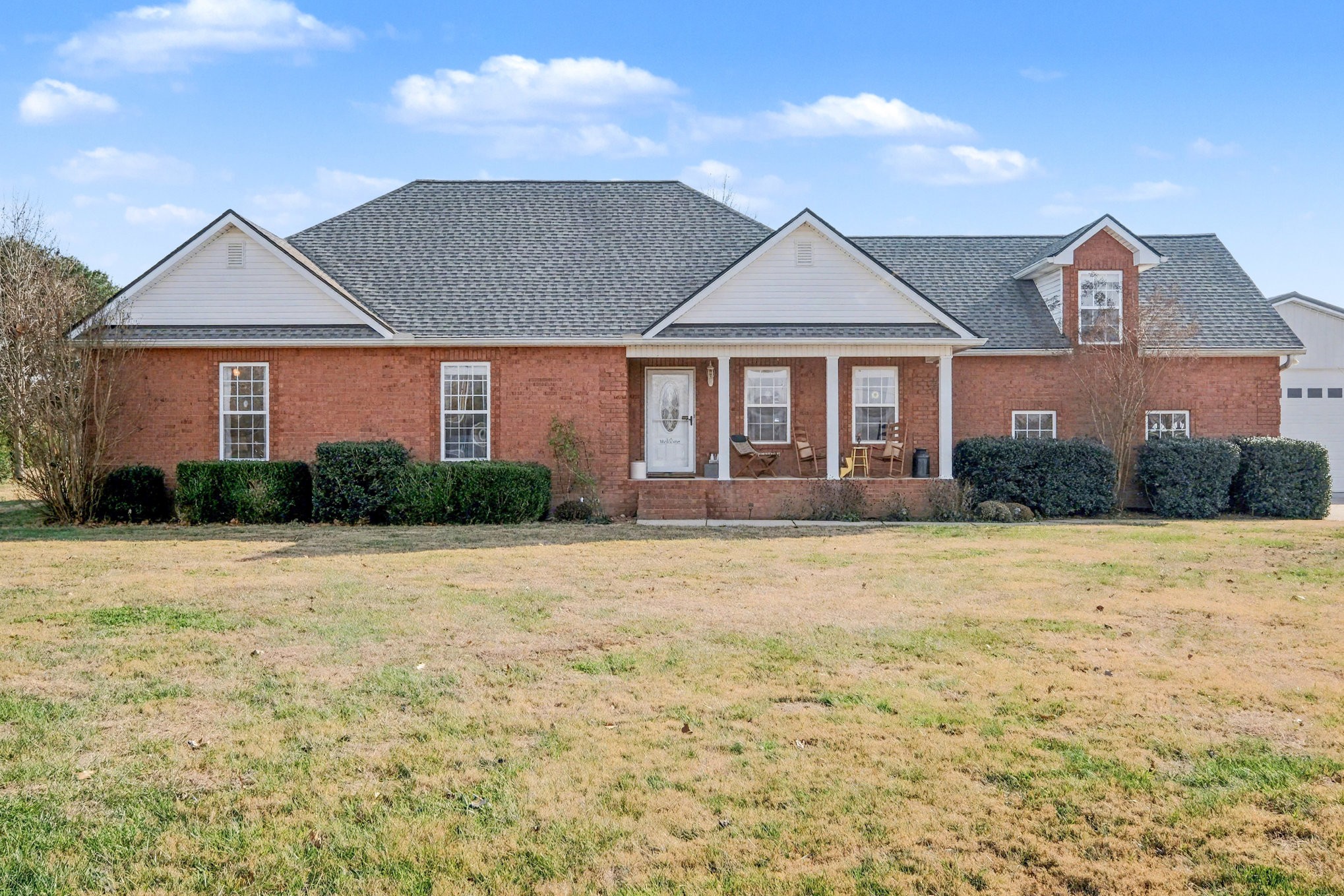 1002 Roland Court Cottontown, TN 37048 - Photo 10 of 41 a front view of a house with a yard and garage