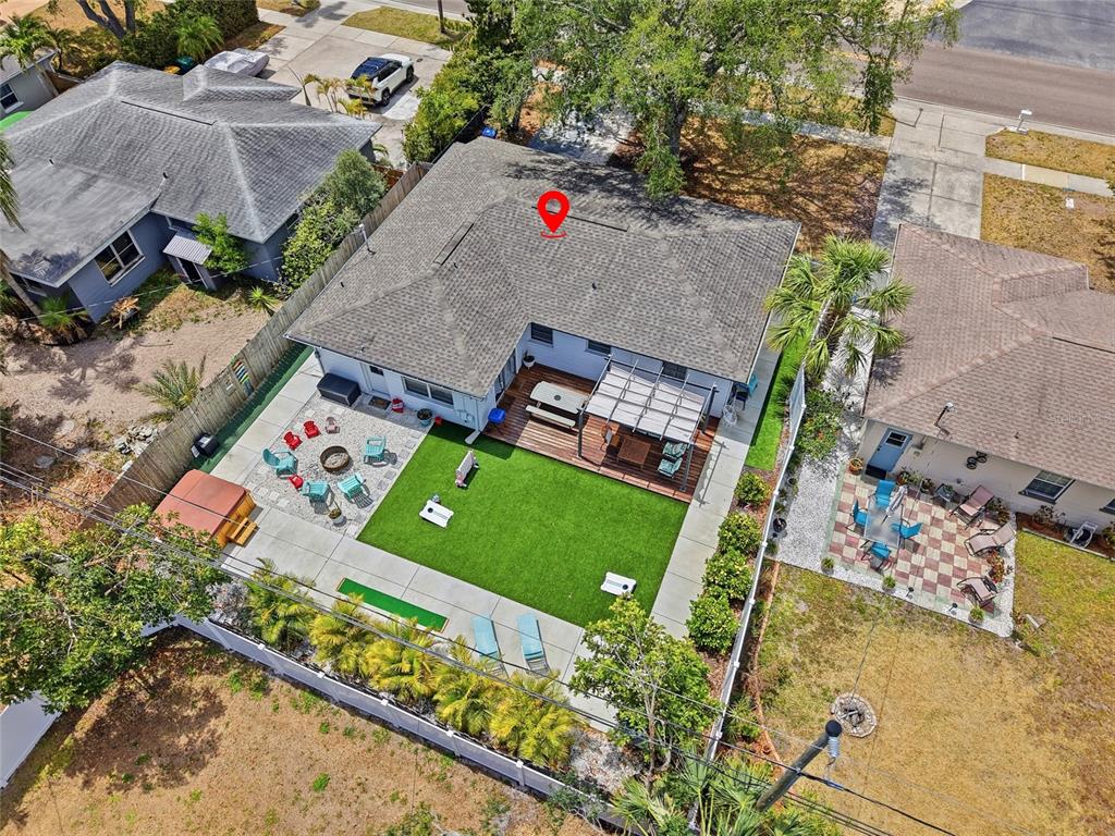 4939 100th Way North St. Petersburg, FL 33708 - Photo 36 of 43 an aerial view of a yard with an outdoor space