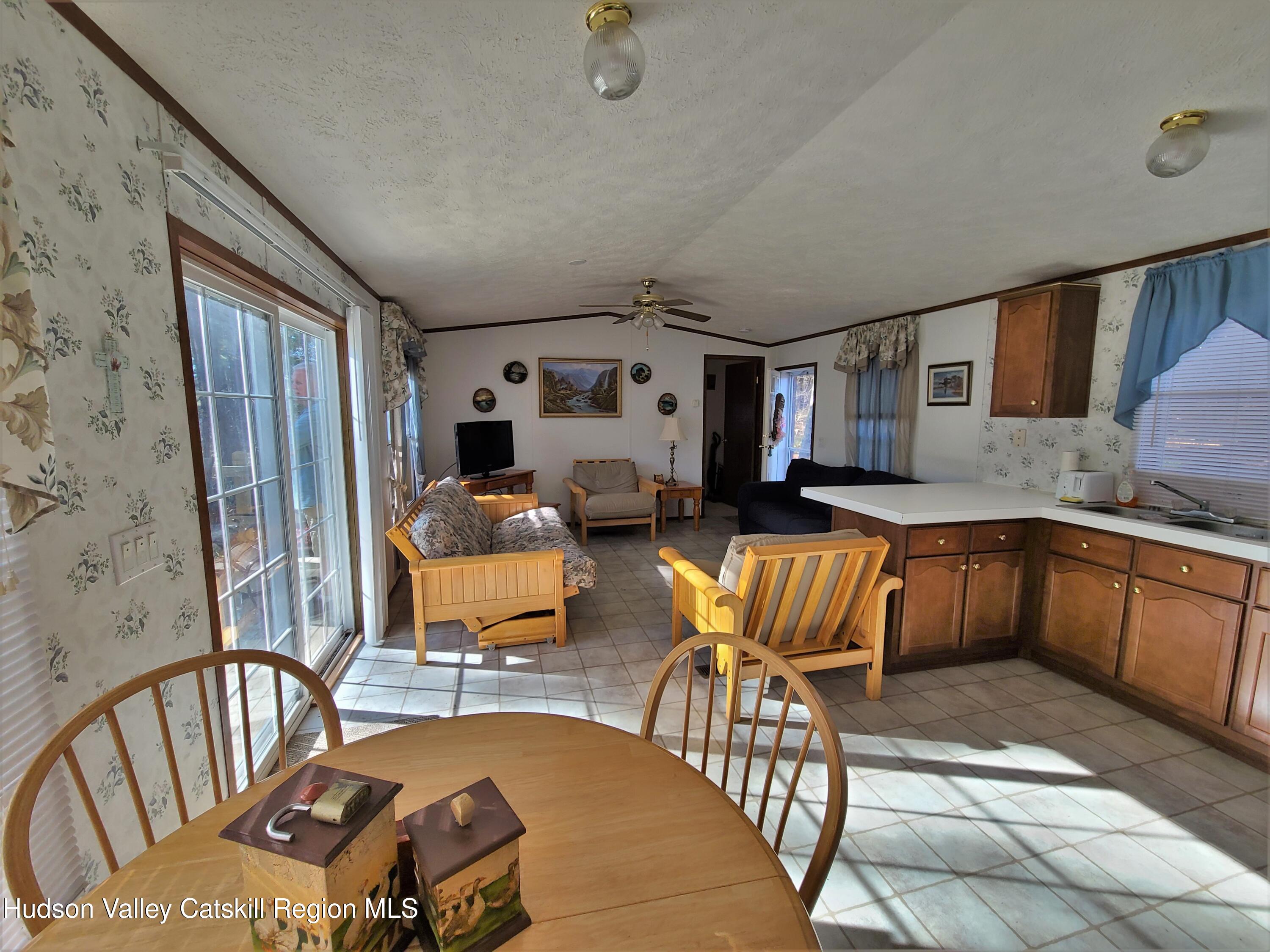 25 George Segar Road Bethel, NY 12783 - Photo 11 of 28 a bedroom with furniture and a rug