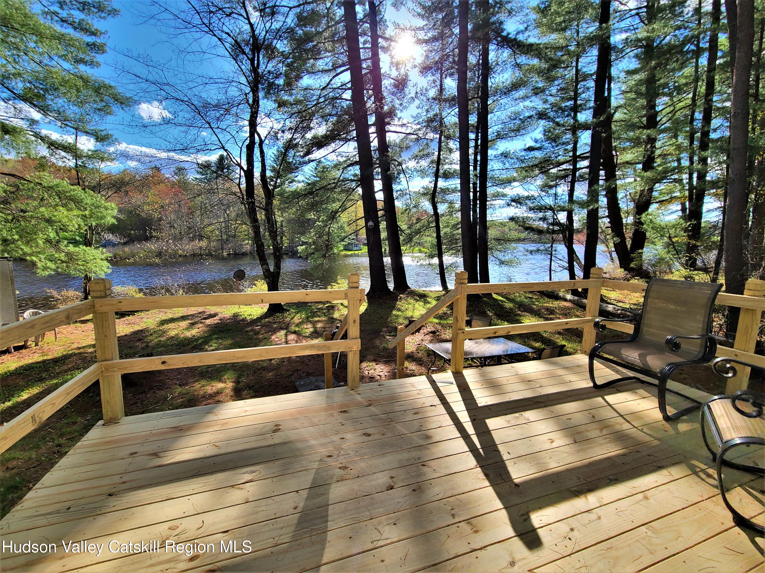25 George Segar Road Bethel, NY 12783 - Photo 15 of 28 a view of a swimming pool with chairs and tables