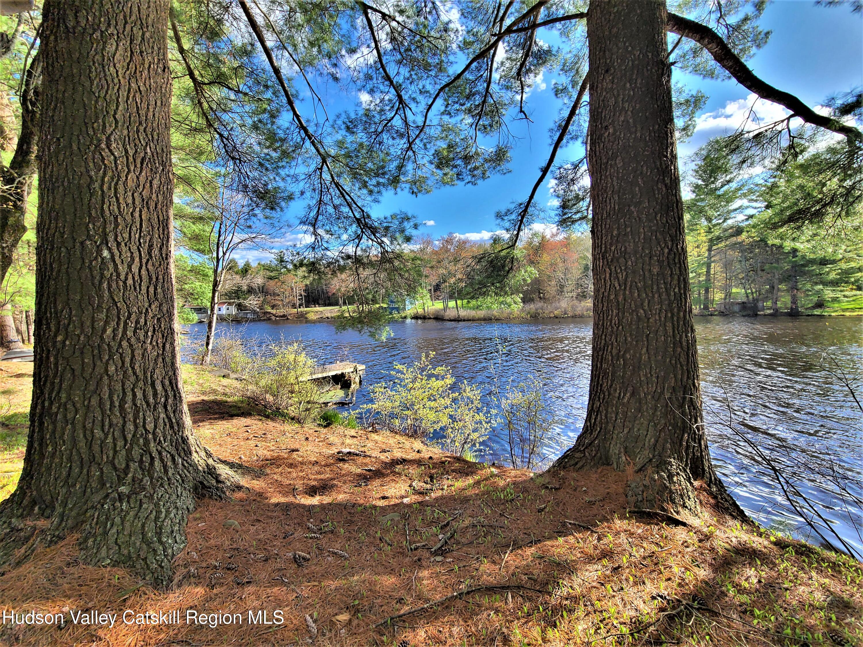 25 George Segar Road Bethel, NY 12783 - Photo 21 of 28 a view of a lake from a balcony