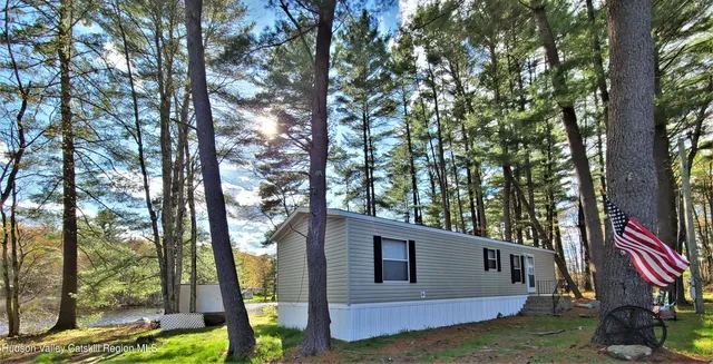 a backyard of a house with seating space