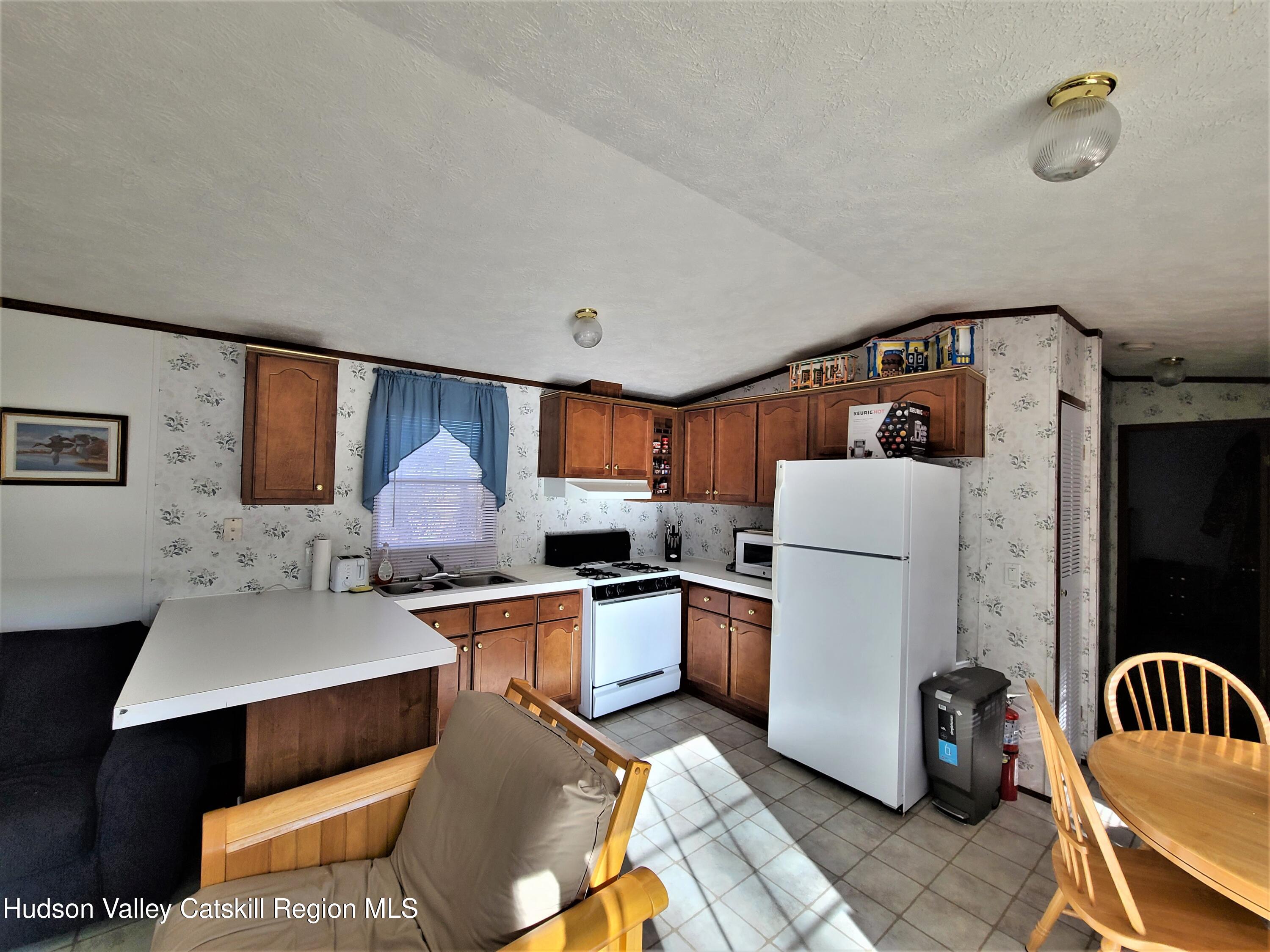 25 George Segar Road Bethel, NY 12783 - Photo 10 of 28 a living room with furniture and a window
