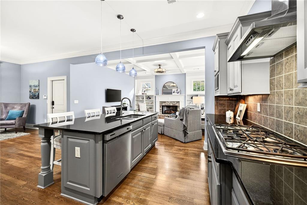 455 High Pointe Trail Roswell, GA 30076 - Photo 13 of 46 a kitchen with stainless steel appliances granite countertop a stove and a sink