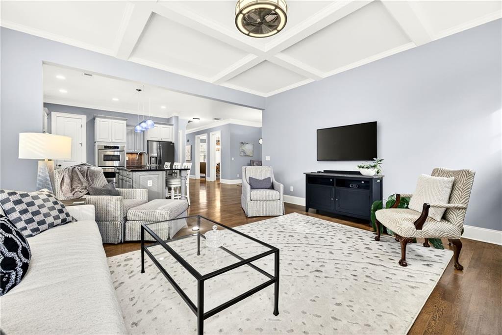 455 High Pointe Trail Roswell, GA 30076 - Photo 17 of 46 a living room with furniture a rug and a flat screen tv
