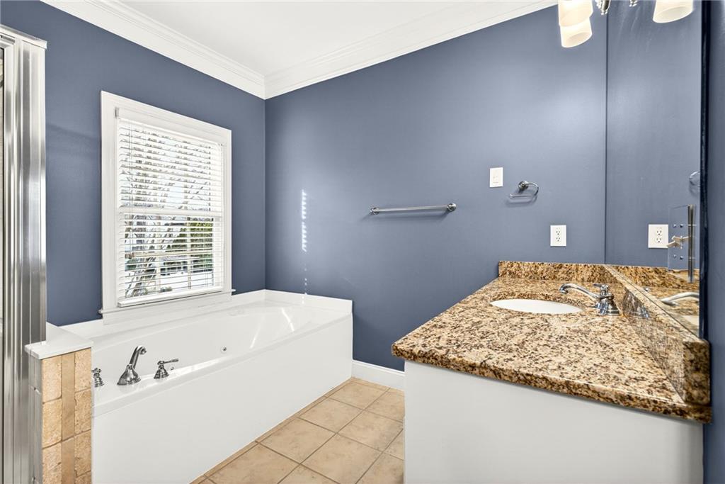 455 High Pointe Trail Roswell, GA 30076 - Photo 27 of 46 a bathroom with a tub sink and mirror