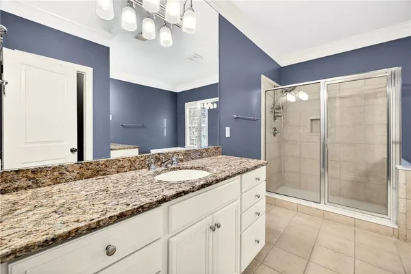 a bedroom with furniture and a fireplace