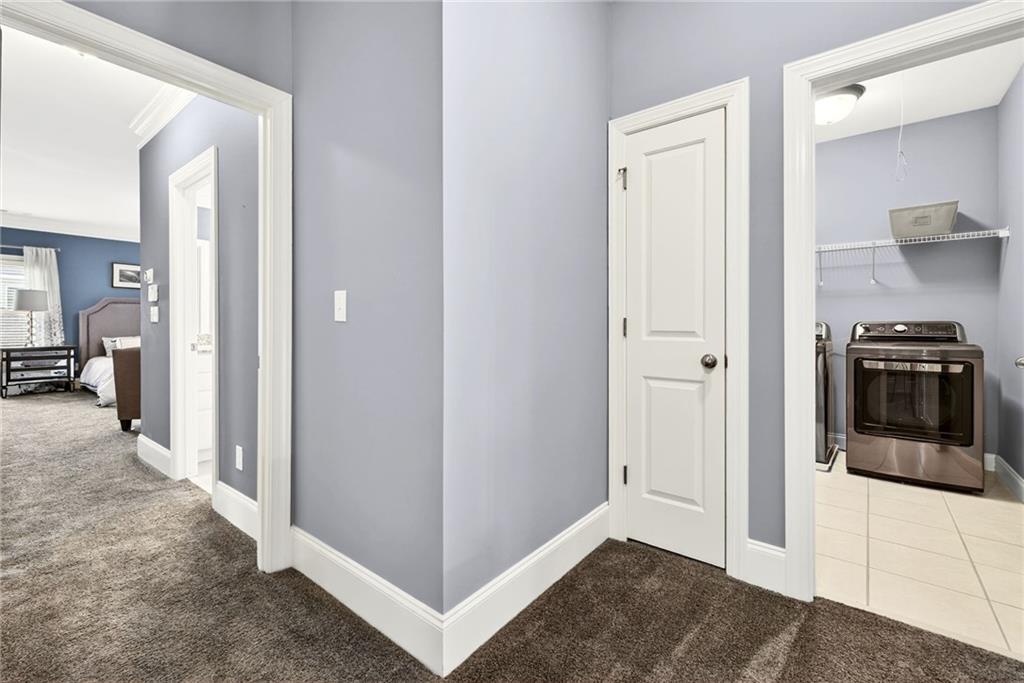 455 High Pointe Trail Roswell, GA 30076 - Photo 29 of 46 a view of a kitchen from a hallway