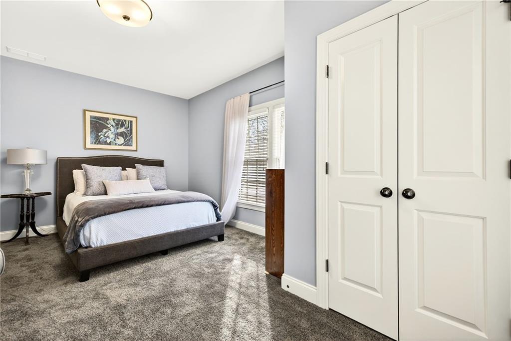 455 High Pointe Trail Roswell, GA 30076 - Photo 31 of 46 a bedroom with a bed and a window