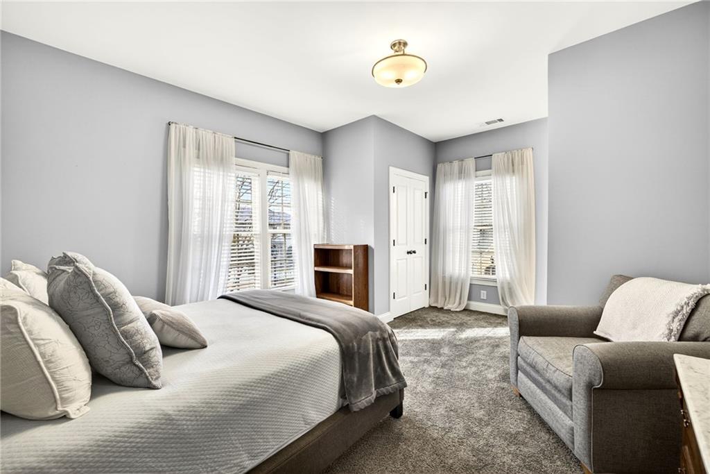 455 High Pointe Trail Roswell, GA 30076 - Photo 32 of 46 a bedroom with furniture and a fireplace