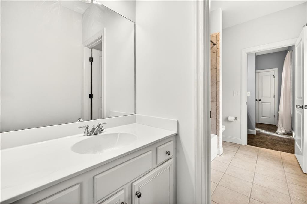 455 High Pointe Trail Roswell, GA 30076 - Photo 33 of 46 a bathroom with a sink and a mirror