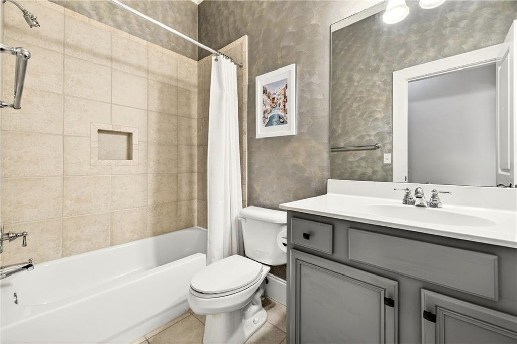 455 High Pointe Trail Roswell, GA 30076 - Photo 5 of 46 a bathroom with a sink toilet and shower