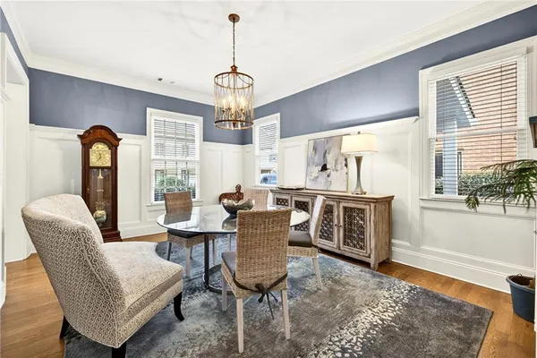 a kitchen with stainless steel appliances a refrigerator a stove a sink and white cabinets