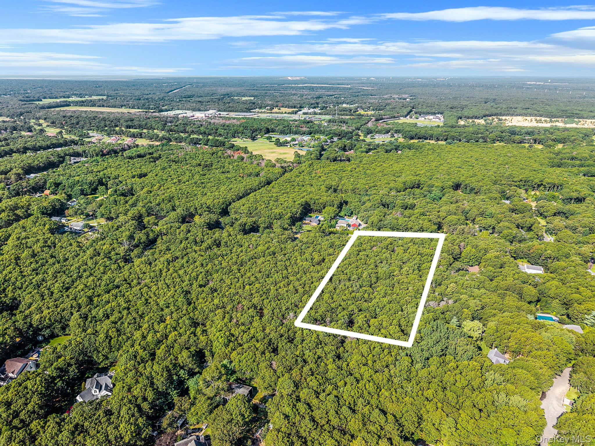 200 Wading River Road Manorville, NY 11949 - Photo 24 of 31 a view of a yard with an ocean view