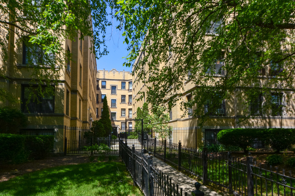 4606 North Beacon Street, Unit 2B Chicago, IL 60640 - Photo 1 of 20 a view of a house with a tree in front of it