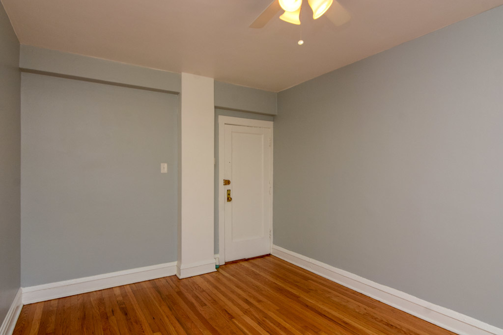 4606 North Beacon Street, Unit 2B Chicago, IL 60640 - Photo 12 of 20 a view of room with a ceiling fan and wooden floor