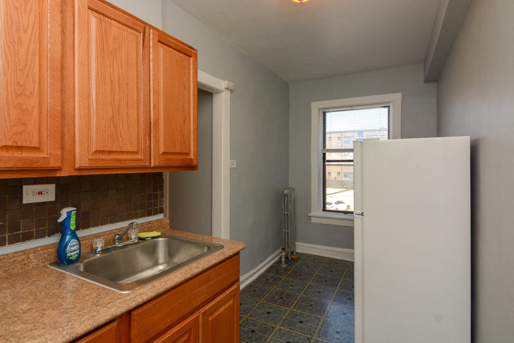 4606 North Beacon Street, Unit 2B Chicago, IL 60640 - Photo 4 of 20 a kitchen with a sink and cabinets