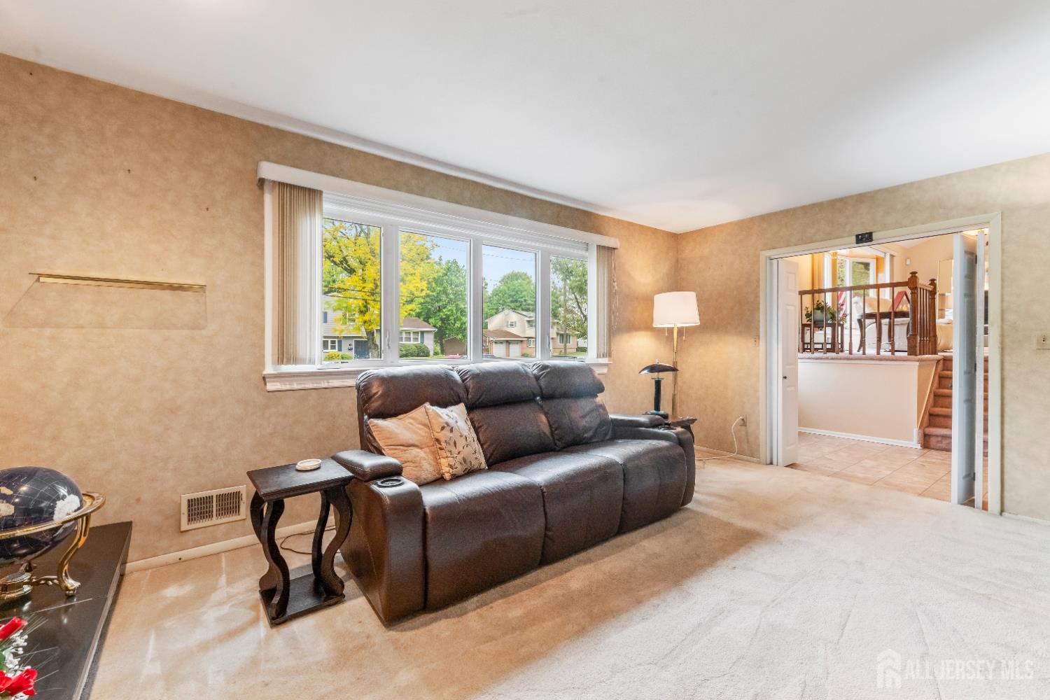 12 Sullivan Way East Brunswick, NJ 08816 - Photo 12 of 40 a living room with furniture and a large window