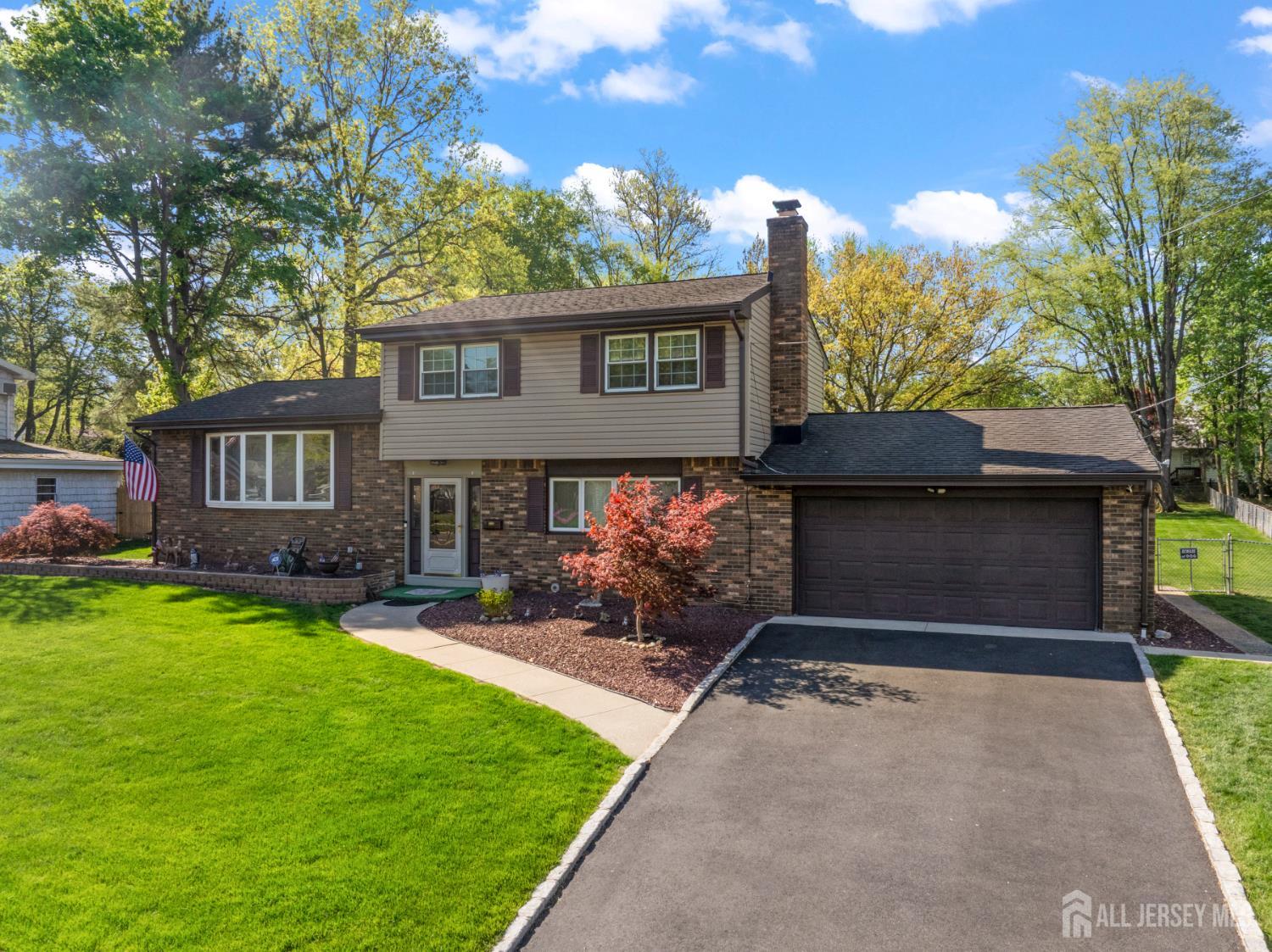 12 Sullivan Way East Brunswick, NJ 08816 - Photo 2 of 40 a front view of a house with garden