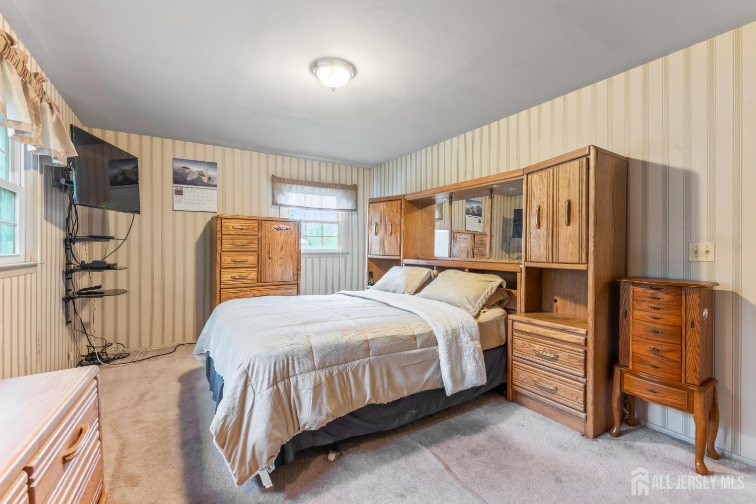 12 Sullivan Way East Brunswick, NJ 08816 - Photo 27 of 40 a bedroom with a bed closet and a window