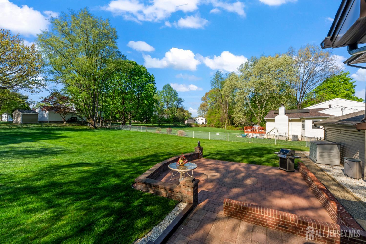 12 Sullivan Way East Brunswick, NJ 08816 - Photo 5 of 40 a view of a garden with a house