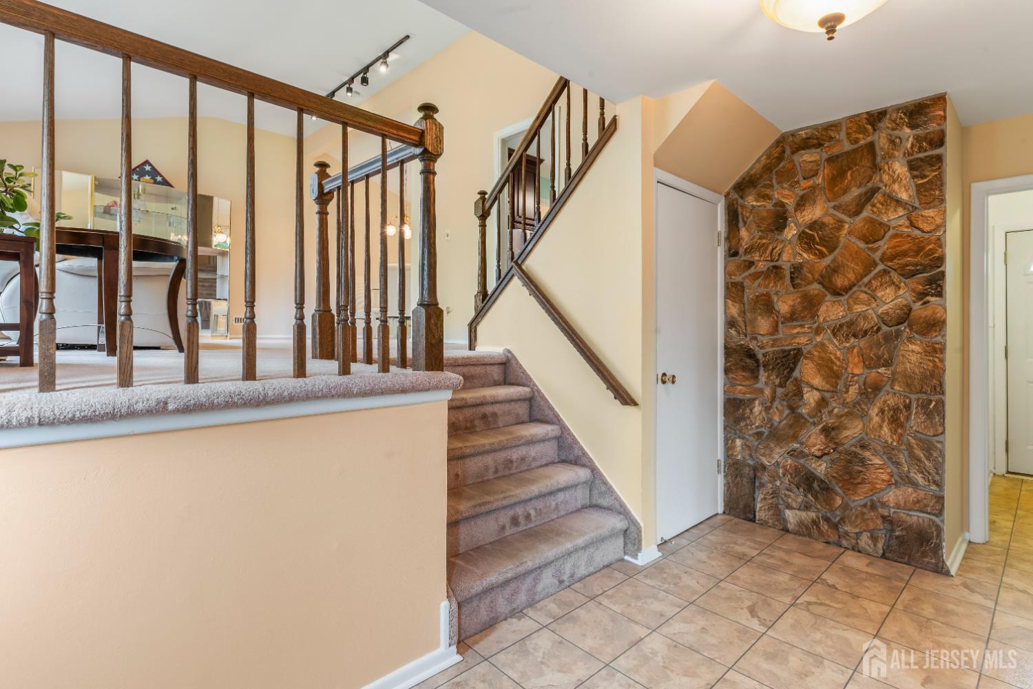 12 Sullivan Way East Brunswick, NJ 08816 - Photo 9 of 40 a view of entryway with wooden floor and stairs