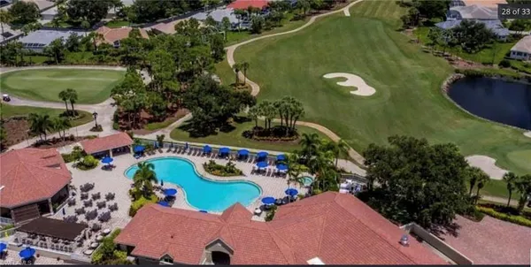 an aerial view of a house with a swimming pool