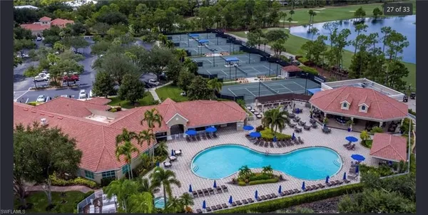 an aerial view of a swimming pool patio and outdoor seating