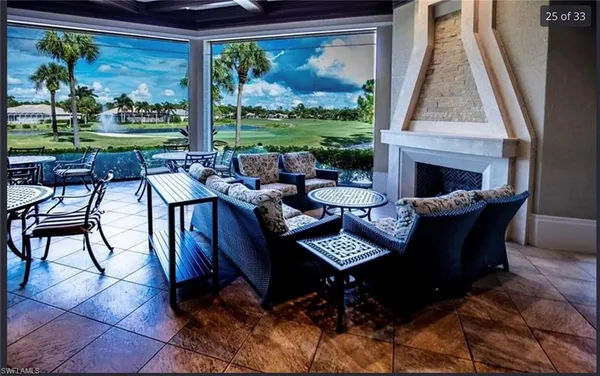 a view of a dining room with furniture wooden floor and a floor to ceiling window