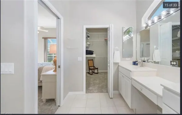 a bathroom with a double vanity sink and mirror