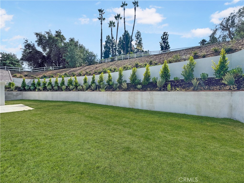 30233 Del Rey Road Temecula, CA 92591 - Photo 11 of 64 a view of a pathway with a wrought fence