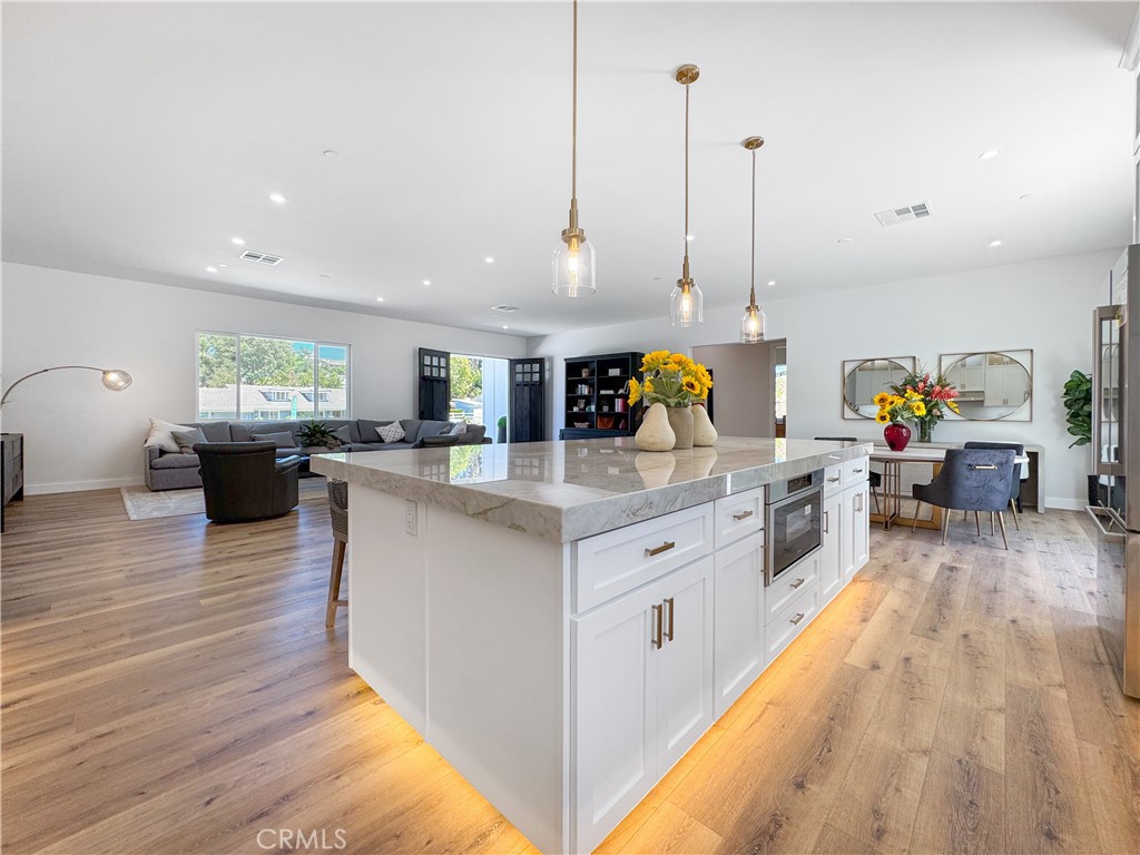 30233 Del Rey Road Temecula, CA 92591 - Photo 18 of 64 a kitchen with stainless steel appliances granite countertop a stove oven and a wooden floors
