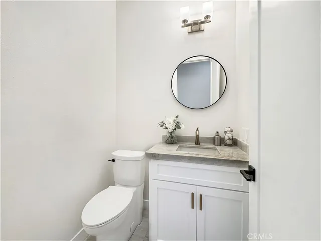 a view of a patio with couches chairs and potted plants