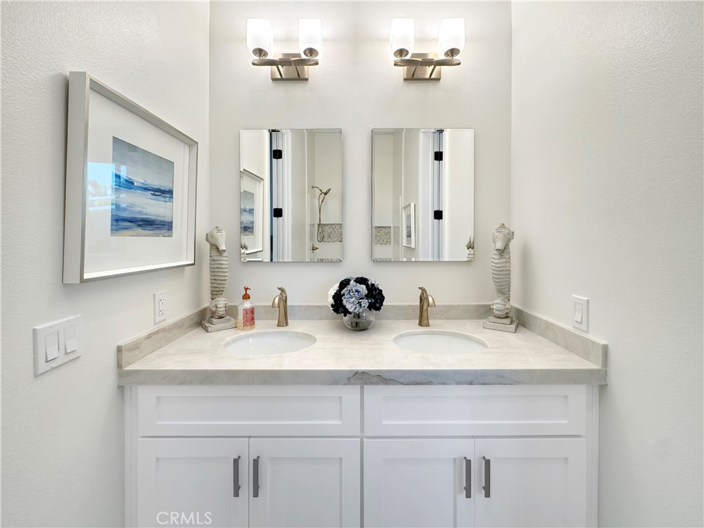 30233 Del Rey Road Temecula, CA 92591 - Photo 34 of 64 a bathroom with double sink and a mirror