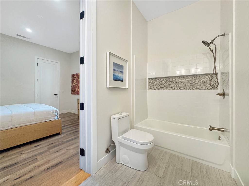 30233 Del Rey Road Temecula, CA 92591 - Photo 36 of 64 a bathroom with a toilet and a shower