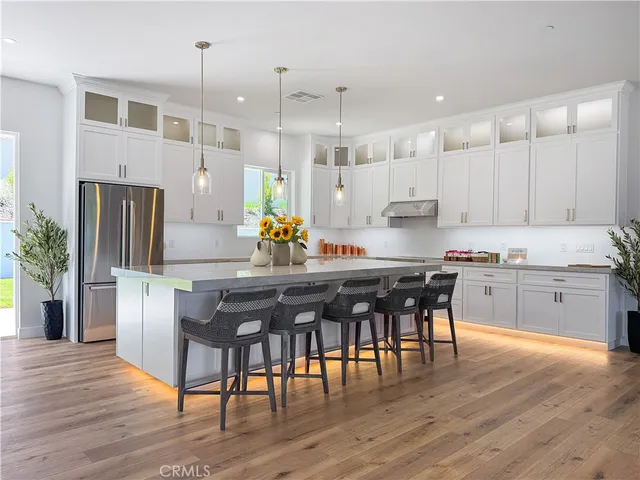 a bathroom with double sink and a mirror