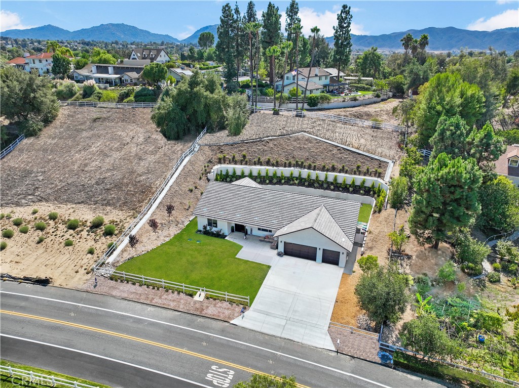 30233 Del Rey Road Temecula, CA 92591 - Photo 9 of 64 an aerial view of a house with a garden and trees
