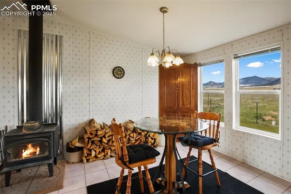 a kitchen with a sink a counter space and a dining table