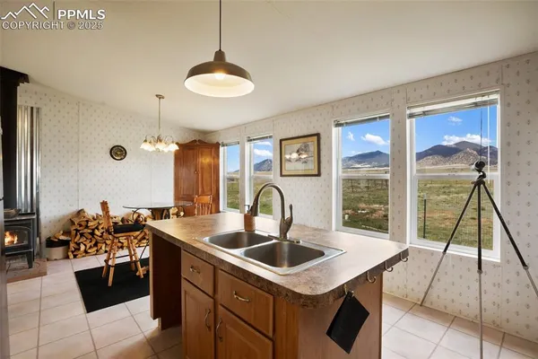 a open kitchen with stainless steel appliances granite countertop a stove and refrigerator