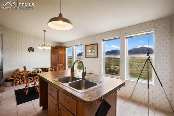 a kitchen with a sink stove and refrigerator