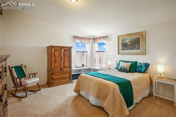 a bedroom with a bed and a cabinets