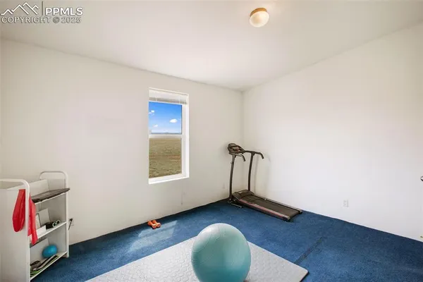 an empty room with wooden floor