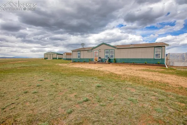 a view of a large body of water with a house in the background