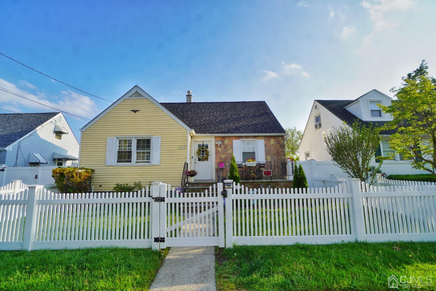 379 Summit Avenue Perth Amboy, NJ 08861 - Photo 2 of 22 a front view of a house with a garden